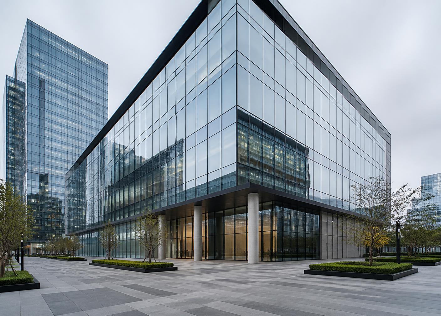 Modern glass-facade commercial office building in a business district