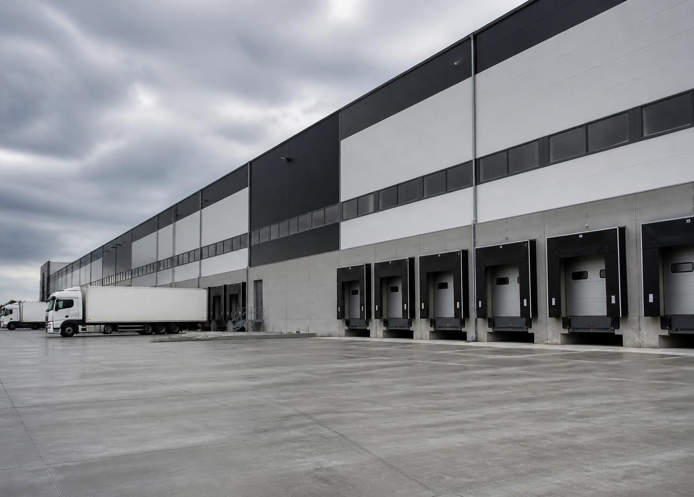 Industrial distribution warehouse exterior with a row of loading docks